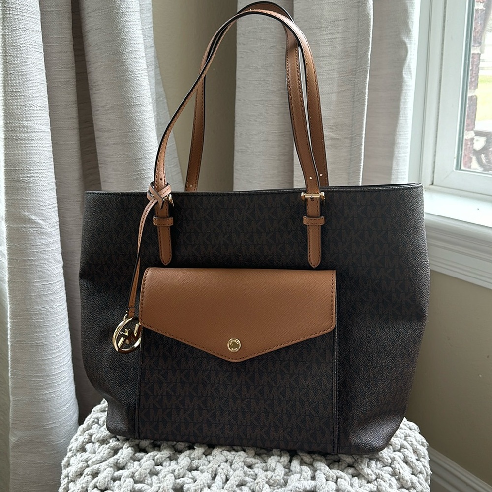 Michael Kors monogram handbag in brown and gold.